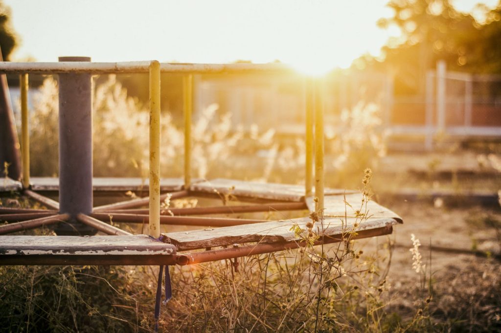 brown metal playground during golden hour