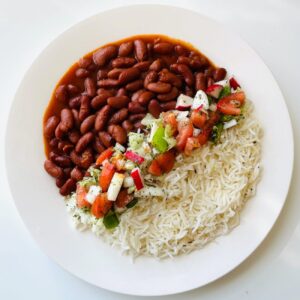 cooked rice with vegetables on white ceramic plate